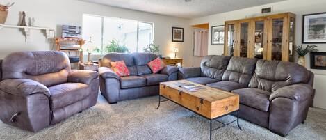 Huge living room with plush couches and recliner. Queen sofa bed. 