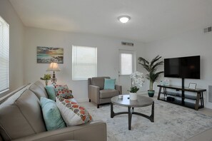 Living room with new leather sofa and chair.