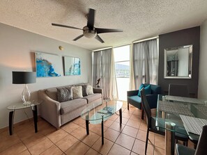 Living area with sofa (sleeps 2) and dining table
