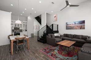 Living room with open access to the dining area, kitchen