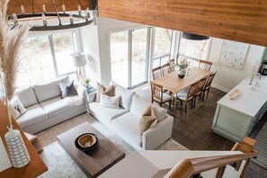 View of living and dining area from staircase