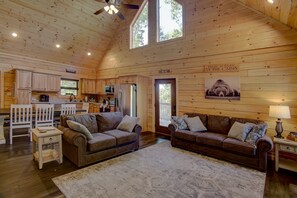 Spacious living area with lots of natural light and beautiful wood details. 