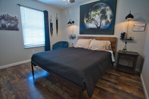 the queen moon room has a nursery closet, chair, and fun lights