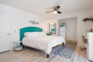 Poolside Suite: 1st floor private suite features king size bed, refrigerator, single cup coffee maker, microwave, small office desk, smart TV, and a daybed with twin trundle.