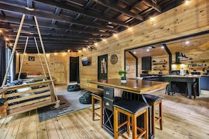 The "porch".  A full enclosed porch is perfect when the weather is right.  A gas grill, outdoor table, porch swing, outdoor shower, and spa awaits.