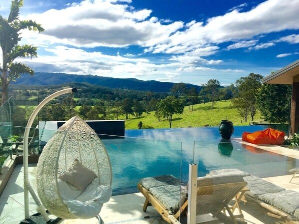 Pool view sunlounge area
