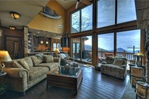 Spacious Open Living Area with 18’ ceilings and mountain views forever