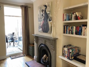 Light airy dining room with traditional a victorian fireplace.