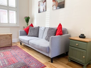 Living room, featuring a comfortable double sofa bed