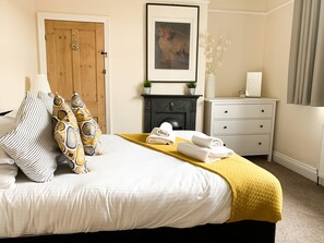 Master bedroom, featuring a king size bed, wardrobe & chester drawers