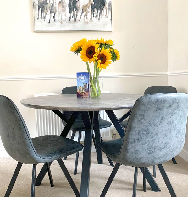 Dining table with four chairs.