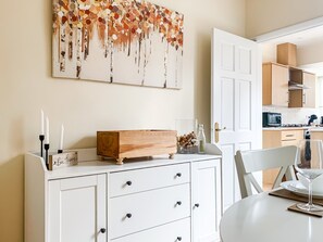 Dining room leading off the kitchen, seating for six guests.