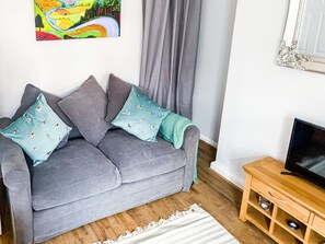 Living room, featuring a comfortable double sofa bed and smart tv