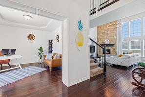 Entry way overlooking living and office