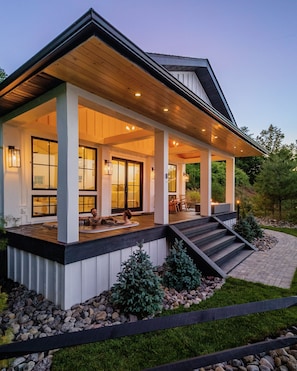 The front of the property, hot tub and fireplace