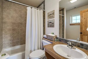 Full Bathroom with tub tile surround.