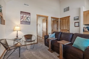 Cozy living area with sofa sleeper.