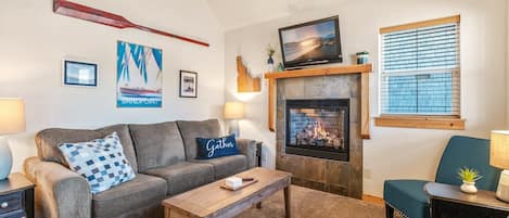 Cozy living room with sofa sleeper.