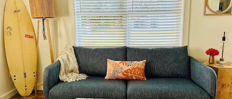 Living Room - relax in the rocker, the couch, or one of the comfy pouffes!   