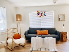 Living Room - relax in the rocker, the couch, or one of the comfy pouffes!   