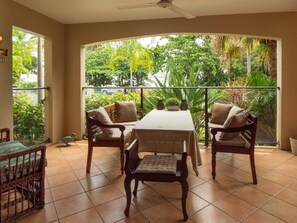 Dine and relax on front deck protected from sun and weather.