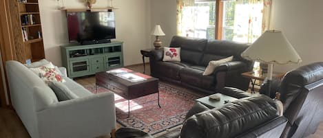 Cozy living room with 55” Smart TV, cable, DVD and blu ray player