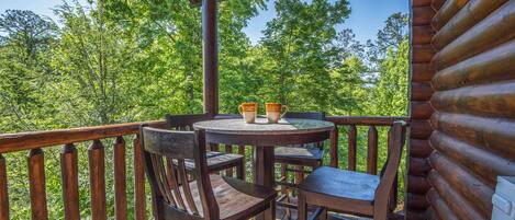 Enjoy morning coffee on the upper covered deck, beautiful natural surroundings.