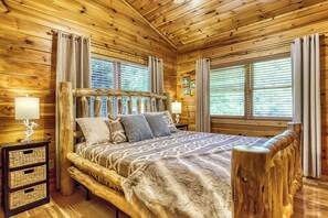 Sleep well surrounded by solid wood floors to ceiling, fan, closet, dresser