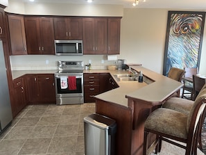 Ample kitchen fully equipped to cook or bake and serve the whole family!