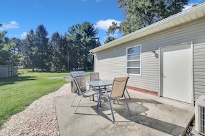 Back patio with propane grill and outdoor seating