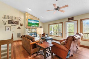 Relaxation Central: Unwind in the living area, complete with a cozy fireplace, adding warmth and charm to your space.