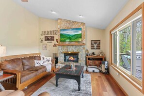 Living Room Comfort: Enjoy the cozy ambiance of a fireplace paired with the entertainment of a TV, creating the perfect retreat for relaxation and leisure.