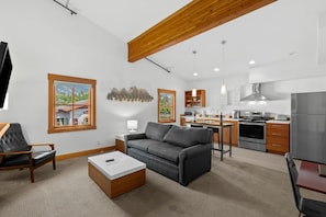 Annapurna-Living Room with Pull-Out Sleeper Sofa and Kitchen with Stainless Steel Appliances and Eating Area.