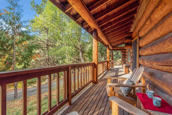 Welcome to Bear Ridge! Log Cabin with a large covered porch to soak in the views.