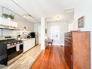 Unleash culinary prowess in our kitchen, adorned with contemporary appliances and spacious countertops.