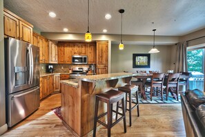 Beautiful kitchen, hardwood floors throughout and wood cabinetry with granite countertops and kitchen island