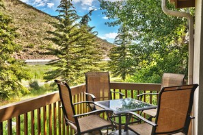 Bistro seating for 4  on the private patio on a sunny summer day