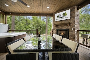 Enjoy the covered decks with outdoor dining, hot tub, TV, gas grill, and gas fireplace.