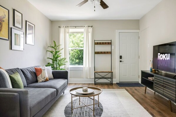 Spacious and comfy living room with a Smart TV with Roku. 