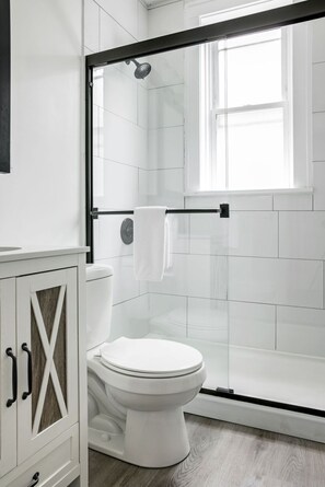 Clean bathroom with a walk-in shower
