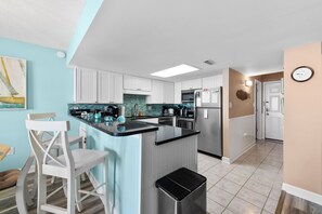 The kitchen counter provides additional space for serving snacks or meals.