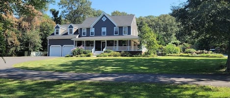 Front of House (4,125 Sq ft) with wrap around porch on 1 acre lot