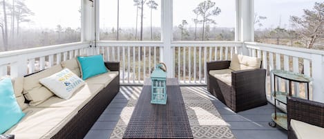 The screened in porch overlooks the bird sanctuary and has great furniture