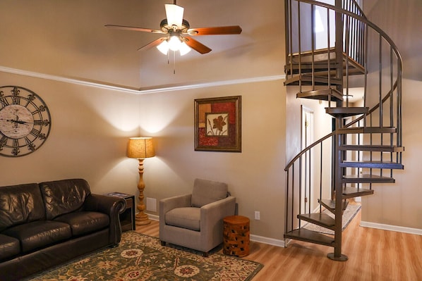 Open and airy living room with vaulted ceiling.