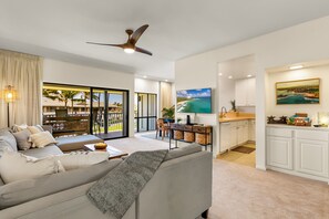 Spacious, open concept living area with high ceilings