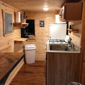 Kitchen with refrigerator, has oven/range, microwave, and coffee maker