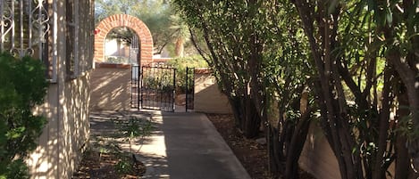 Side of house leads to front/back. Privacy with large oleanders