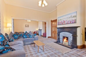 The Presbytery in Coniston sitting room with log fire