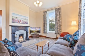 The Presbytery in Coniston sitting room with log fire