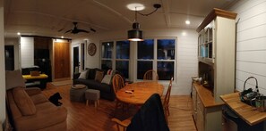 Large living/dining area with view of lake